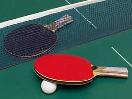 two table tennis rackets and a ball kept on top of the table - Buena Vista Luxury Garden Spa Resort