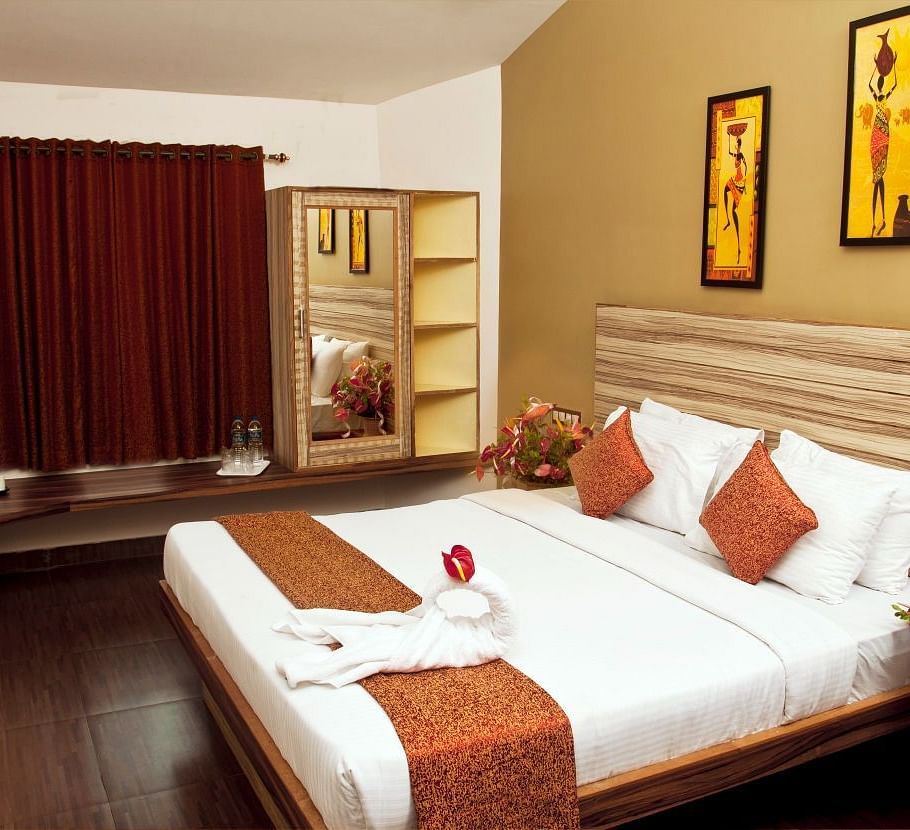 Flora Suite bedroom with a double bed and a wardrobe