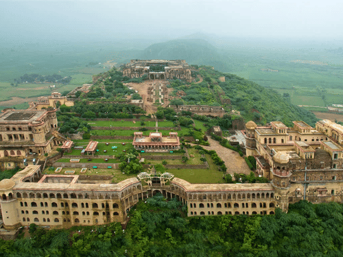 Aerial view of Tijara Fort-Palace - 19th Century, Alwar surrounded by greenery.