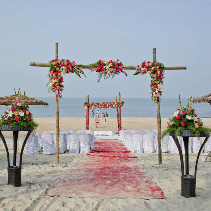 outdoor wedding setup on the beach with the ocean in the background