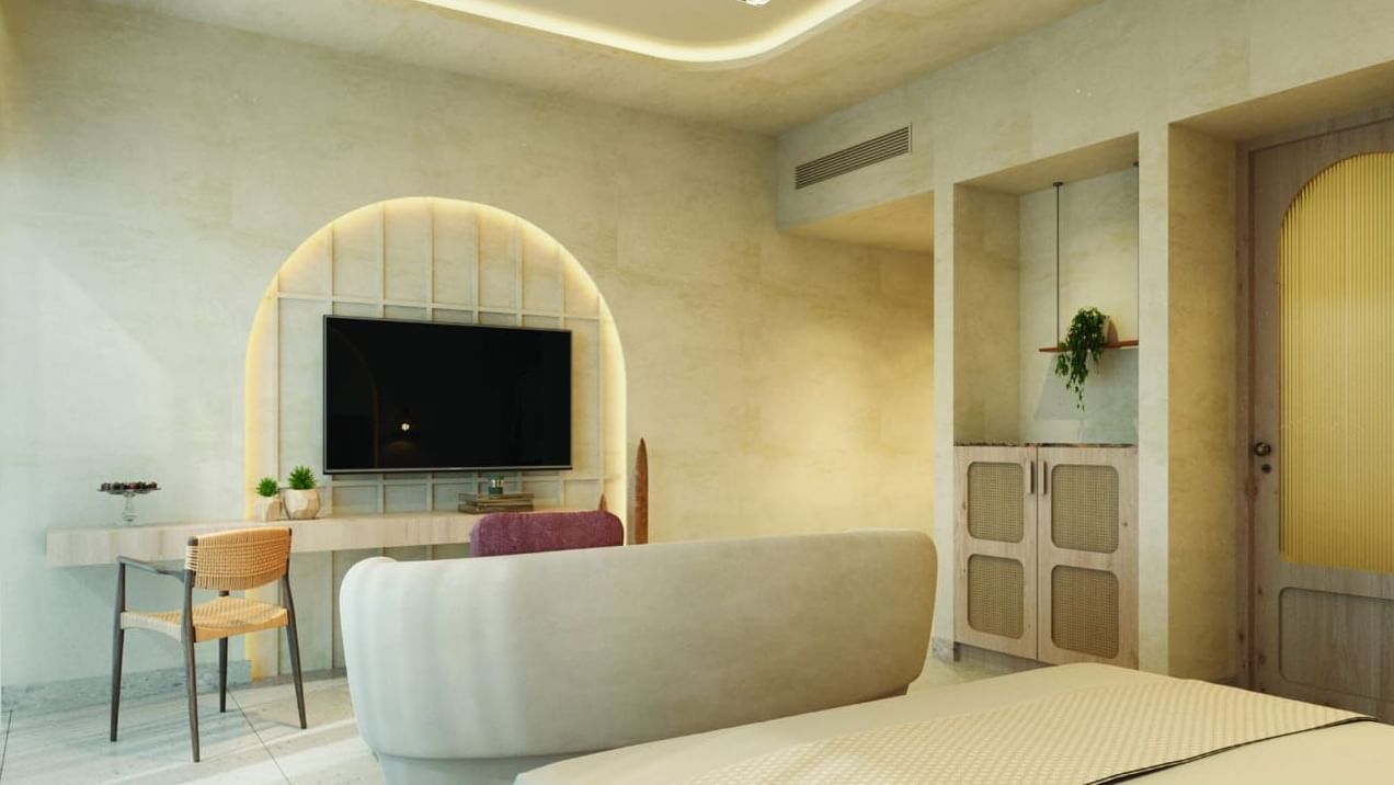 A cosy and elegantly furnished hotel room with warm lighting and minimalist decor - Avanya Resorts Private Limited, Chennai