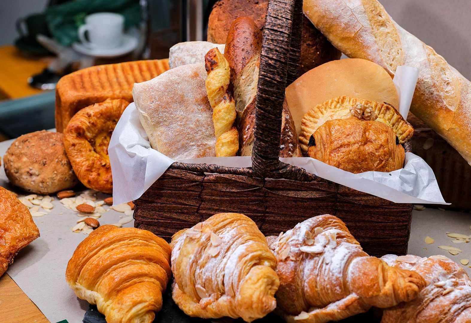 An assortment of pastries and bread on a table | The Shop | Central Mansions, Phnom Penh