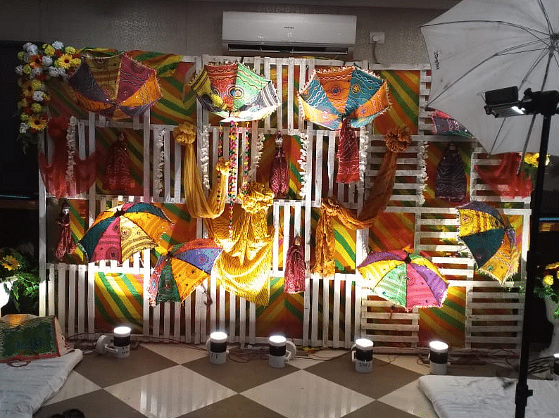Stunning stage backdrop with colourful patterns, drapes, and warm lighting at Central Courtyard Boutique Hotel.