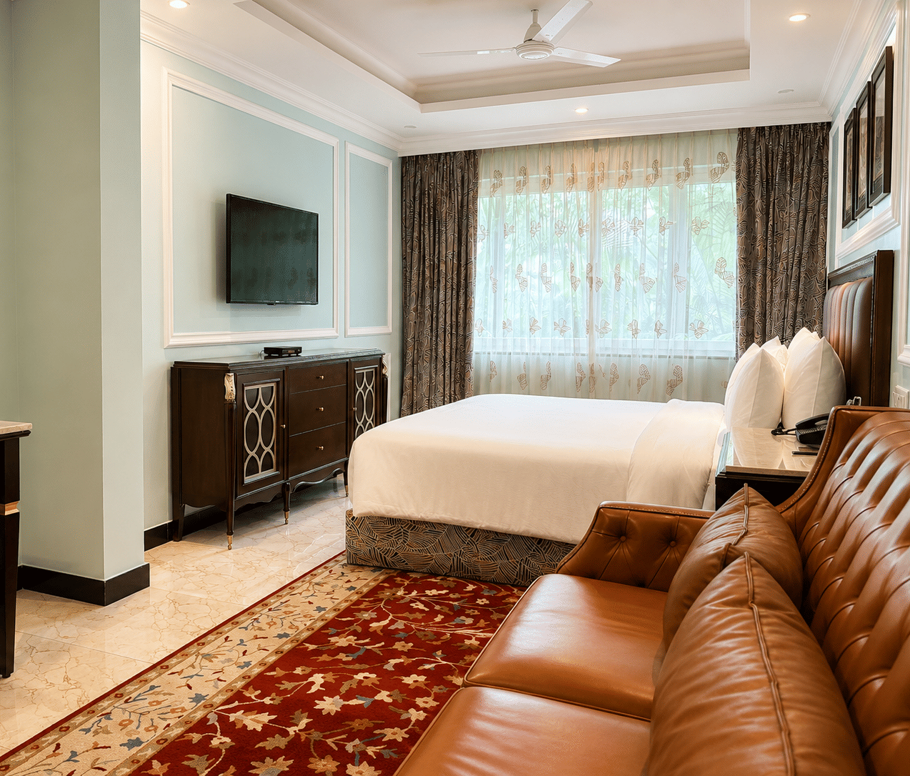 Standard Room with plush bedding and cozy seating area at MAYFAIR Lake Resort, Raipur