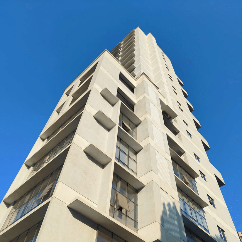 facade images of Maxxvalue Hotel, Chitranjan Tower, Powai, showcasing the concrete building from a lower angle1