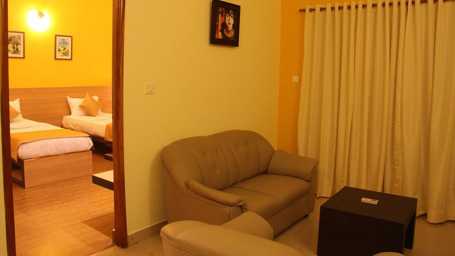 Hotel Arama Suites Bangalore living   bedroom area aura suite 2 hotel arama suites bangalore