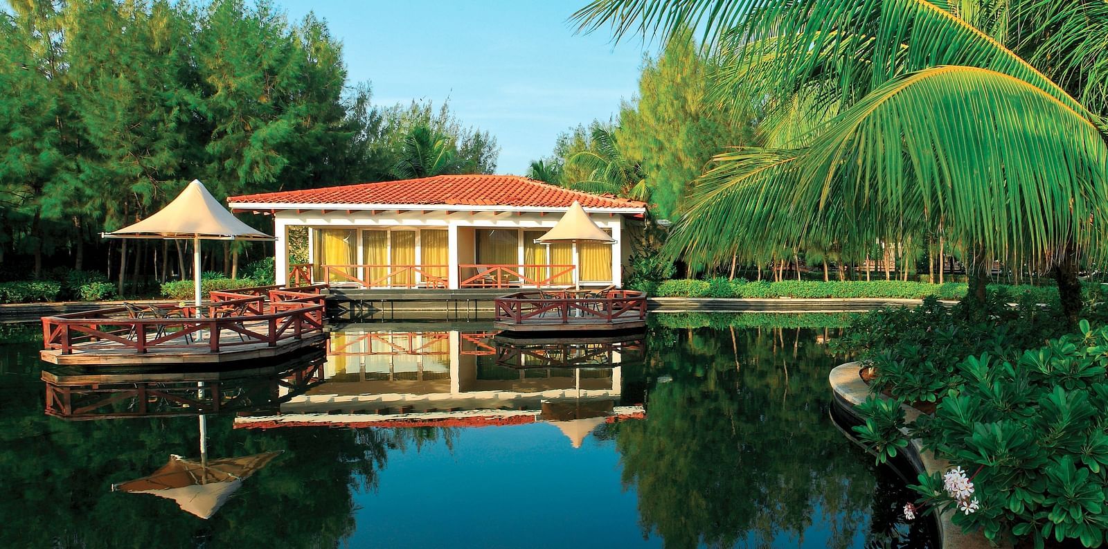 Bermuda Exterior with Deck in front of a lake at Ocean Spray, Pondicherry