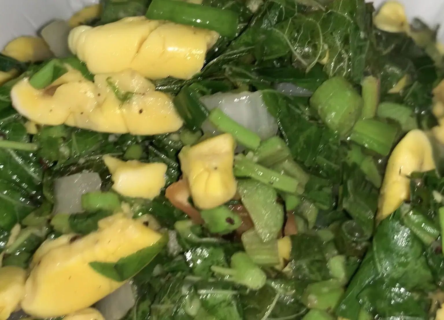 A green salad featuring leafy greens and vegetable pieces | Altamont Court, Jamaica