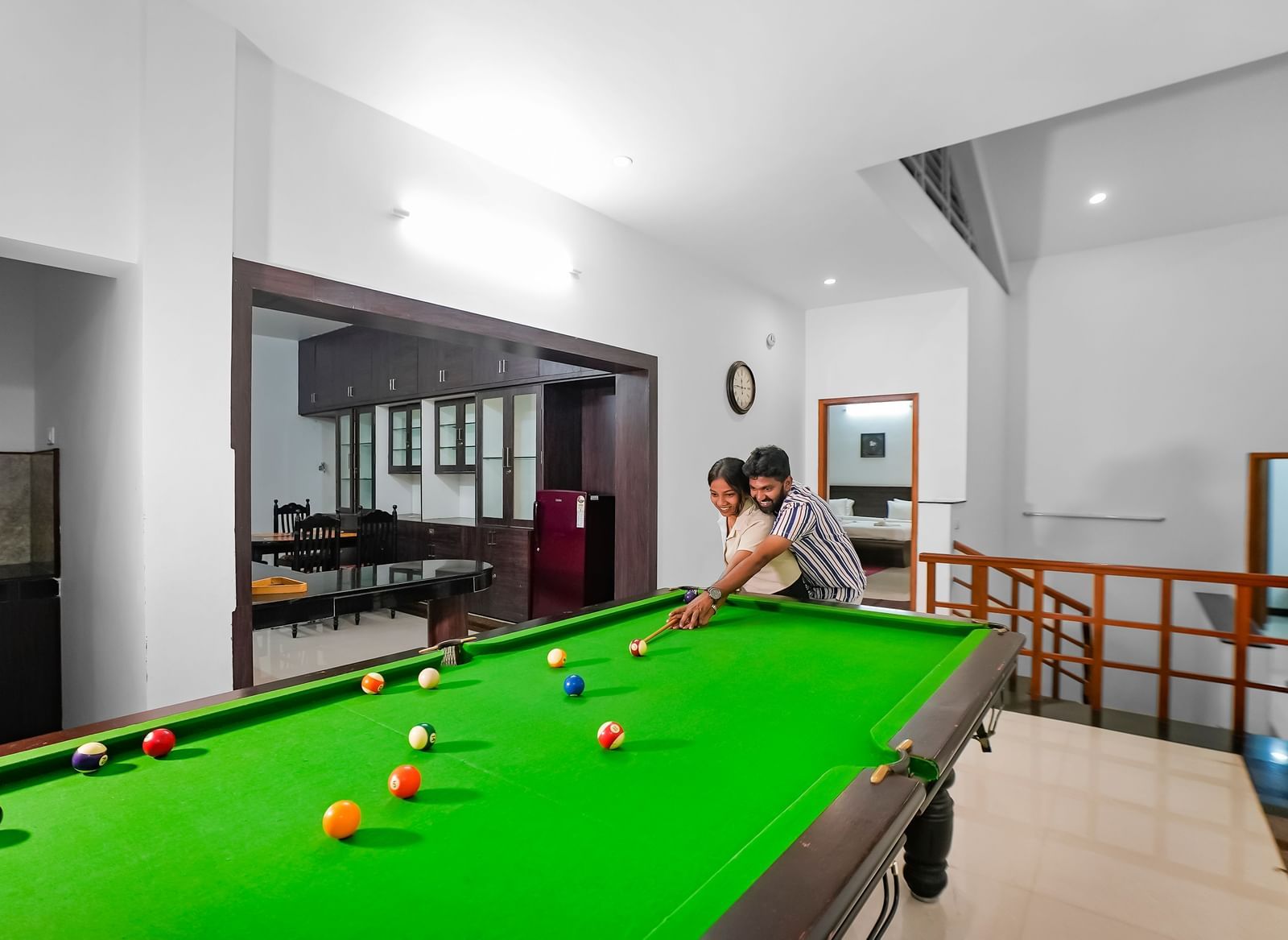 A view of a couple playing pool at WOW Bungalow, Yercaud. 
