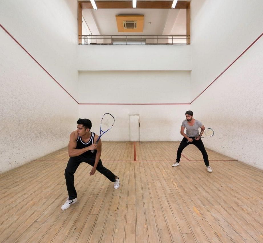 Two men playing Squash at Nirvana Luxury Hotel, Ludhiana.