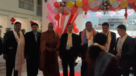 Group of dignitaries, including a monk, at the inauguration of the Mandala Norling Lords Prime hotel in Kathmandu, Nepal, with balloon decorations.