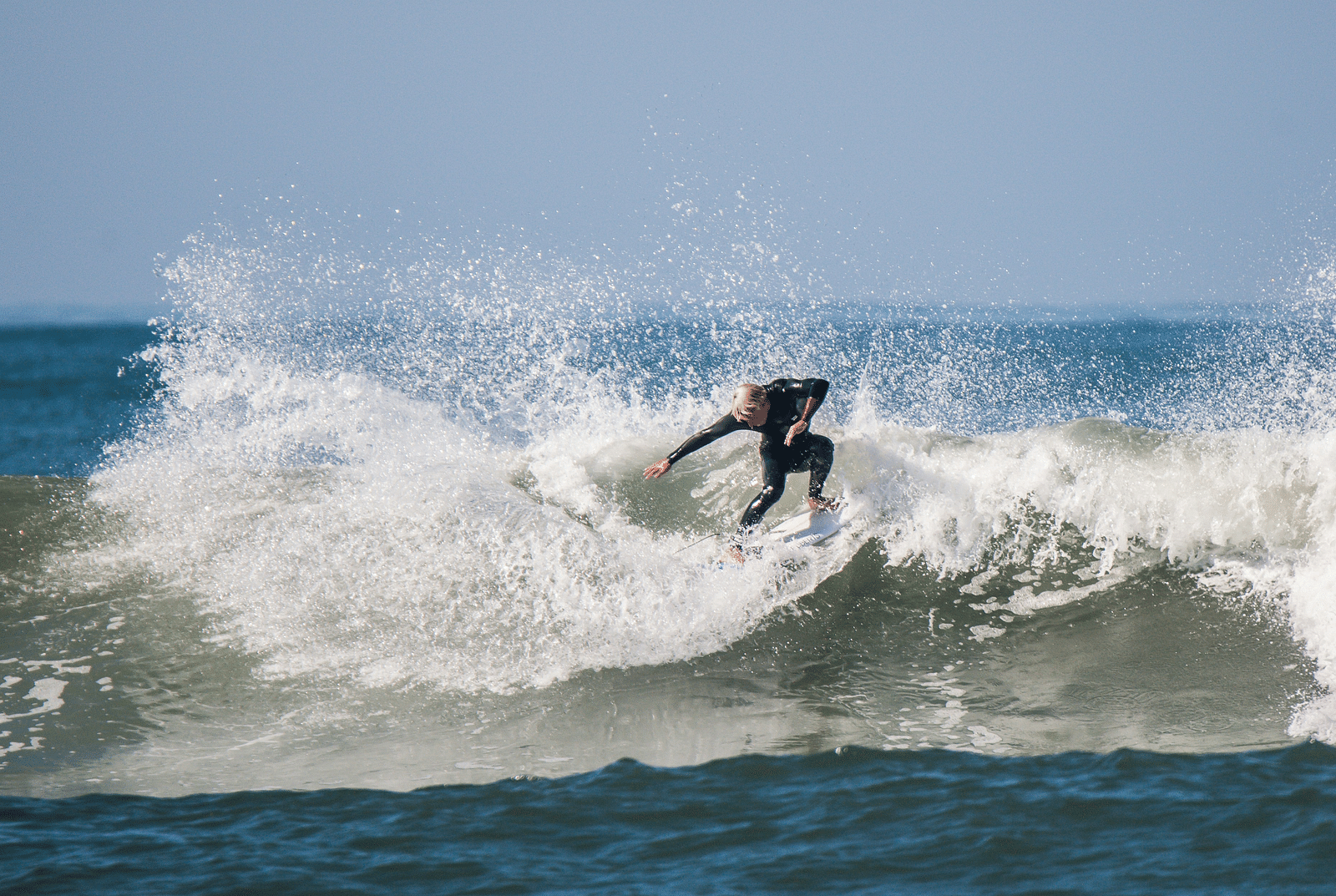image of a person surfing in the ocean waves