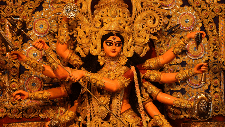 GoddIntricately sculpted and adorned idol of Hindu Goddess Durga during the sacred Dashain festival celebrations in Nepal.ess Durga is adorned for the pooja