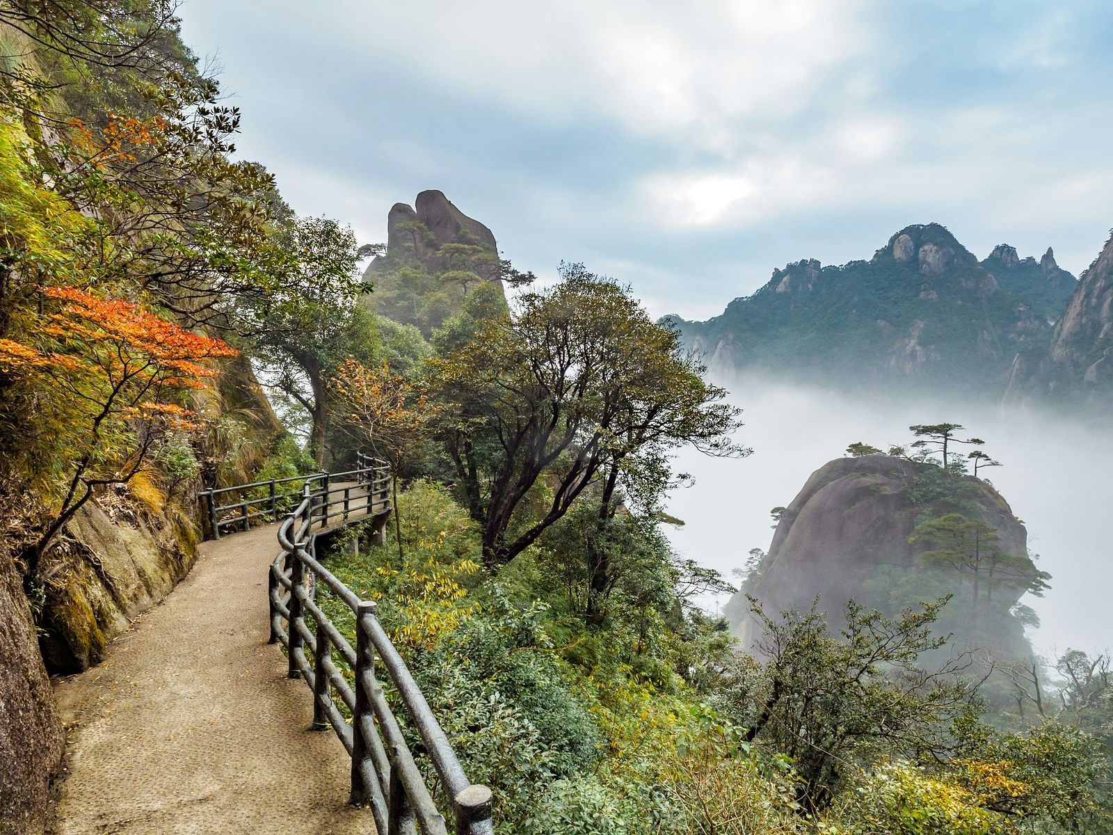 An image of a pathway by the side of mountains