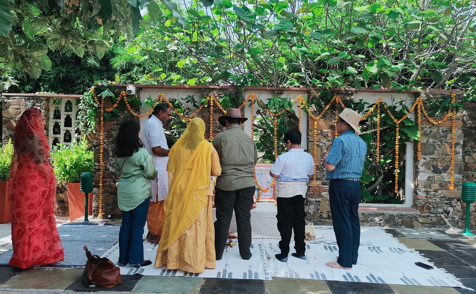 A group of people performing a traditional ceremony with decorations - Utsav Camp