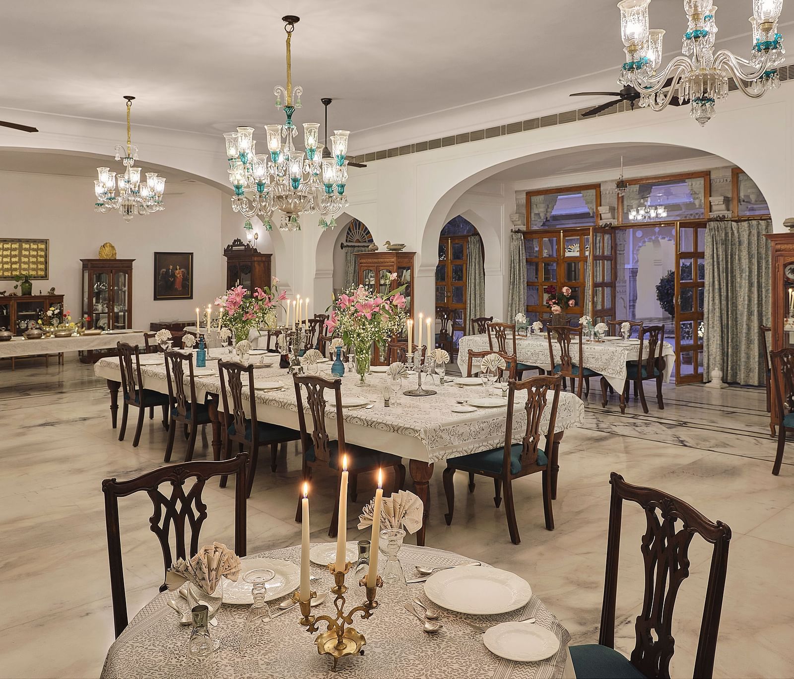 image of an elegant dining hall with chandeliers hanging from the top at dev shree, deogarh