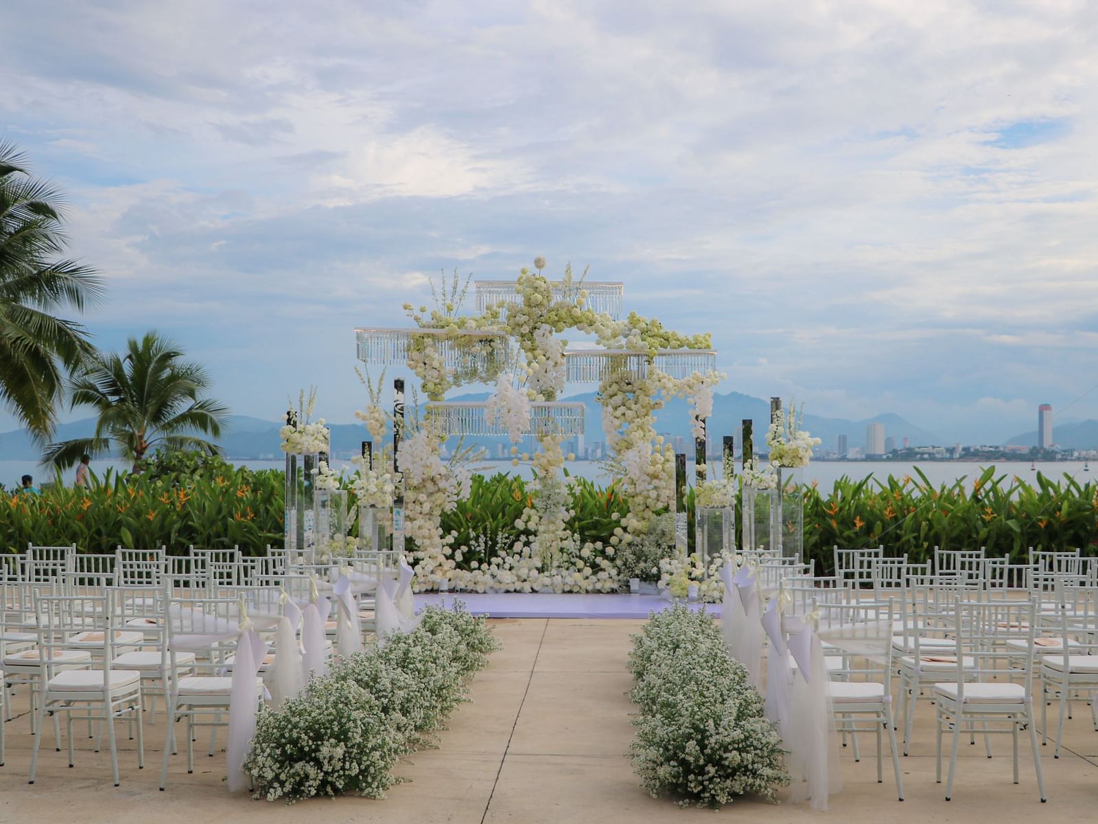 A hall decorated beautifully with flowers and sitting arrangements - Alibu Resort Nha Trang