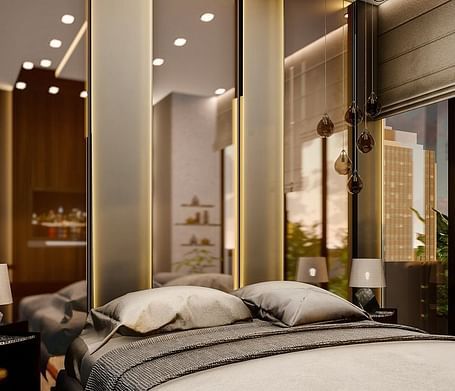 A room with chic and modern interiors with tall mirrors behind the bed.
