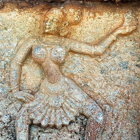 Hampi stone bas-relief of dancing women on a wall