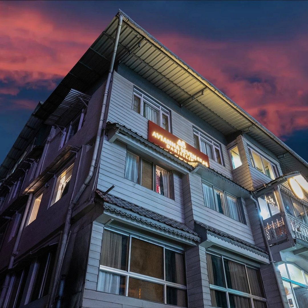 An image of a two storey building which also shows an evening sky in the background - Avianna Group of Hotels & Resorts