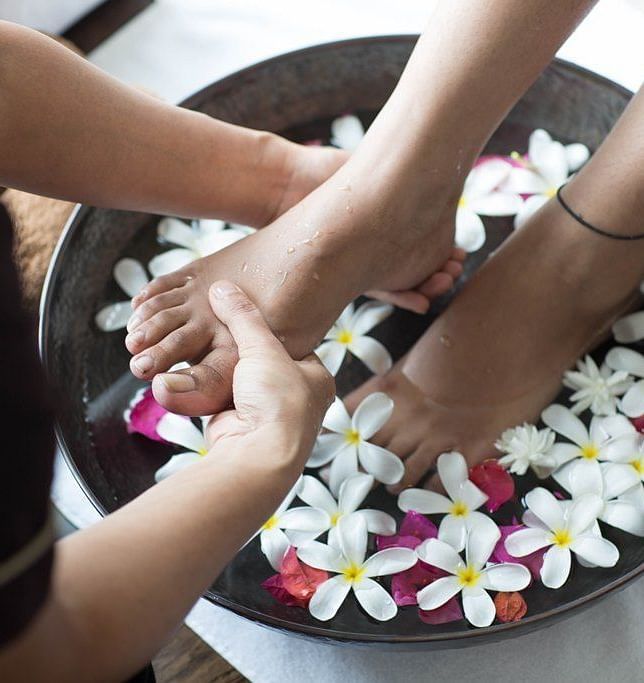 Foot massage with flowers.