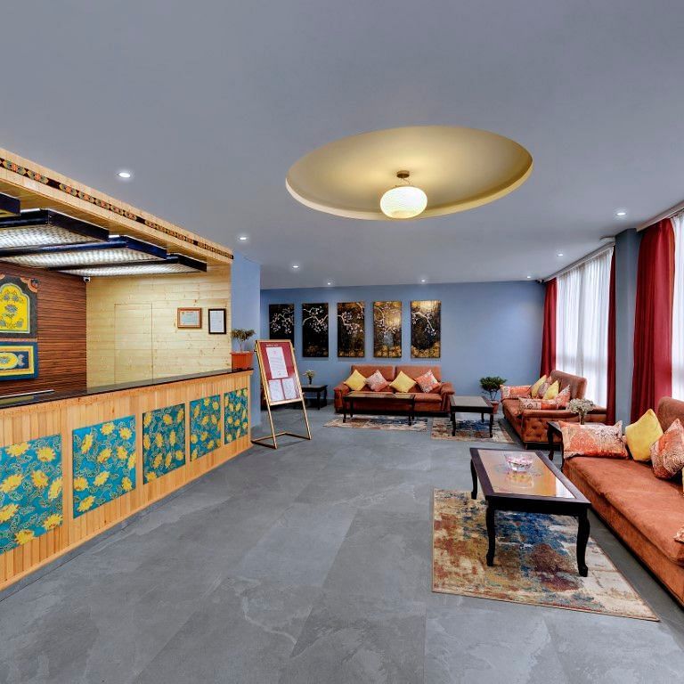 Image of the reception at the property with a cosy couch  | Yashshree Lachung