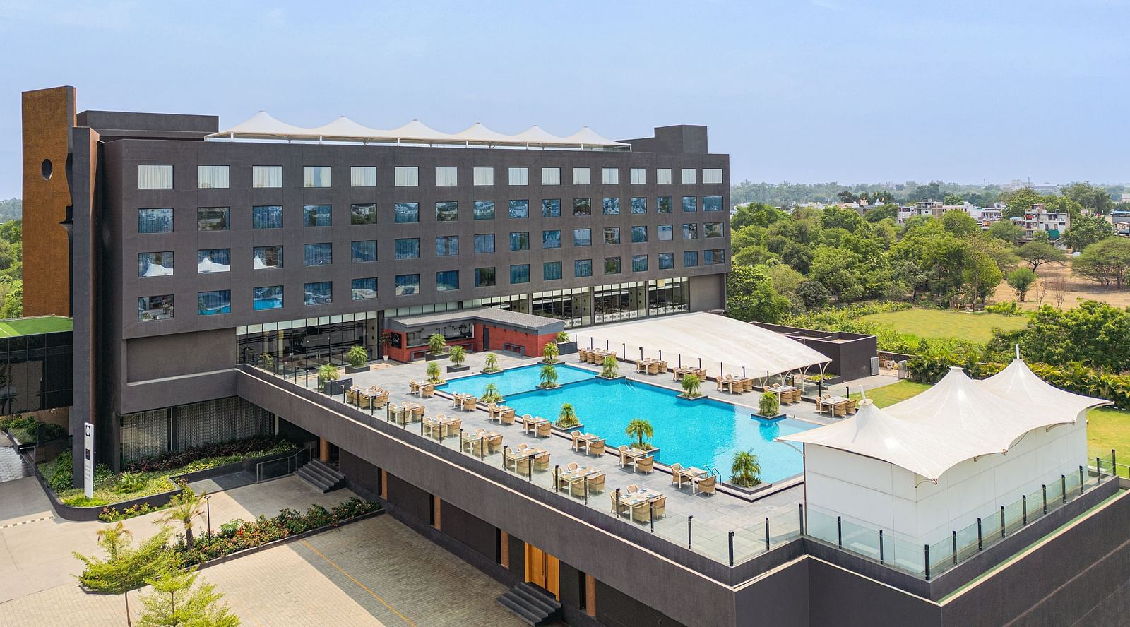Exterior with the swimming pool in view of Essentia Luxury Hotel, Indore during the day