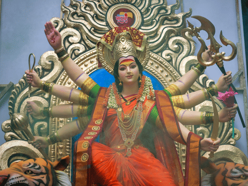 a close up image of the sculpture of a female deity