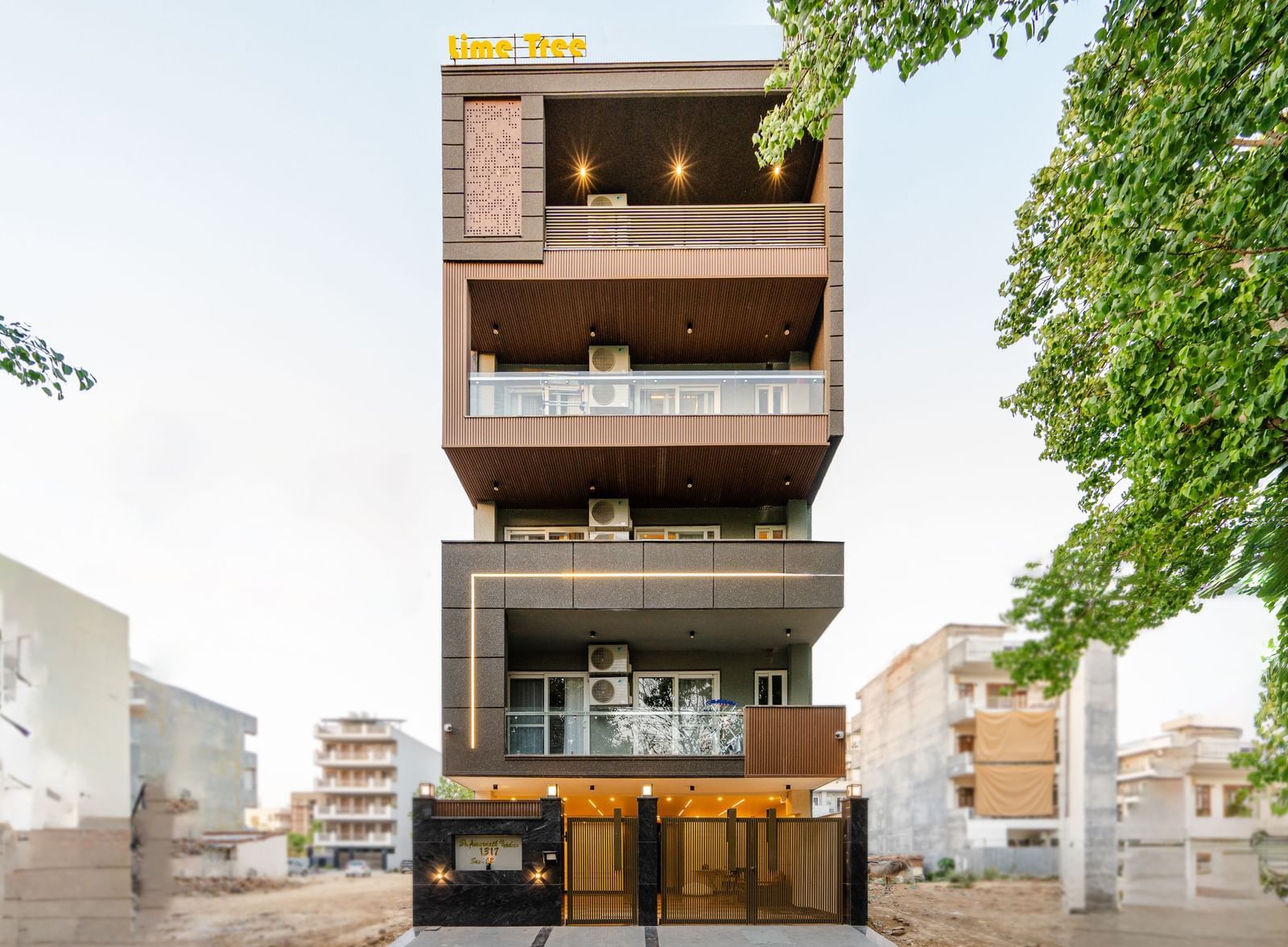 Exterior view of a multi-storey serviced apartment building with balconies at Lime Tree 1BHK Service Apartment Near Artemis Hospital Gurgaon.