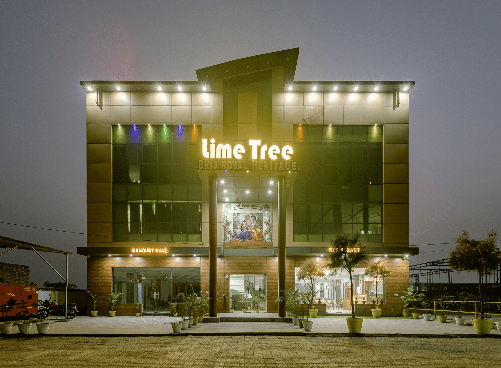 A night view of Lime Tree Hotels & Banquet, Vrindavan building with its signage lit up and entrance clearly visible.