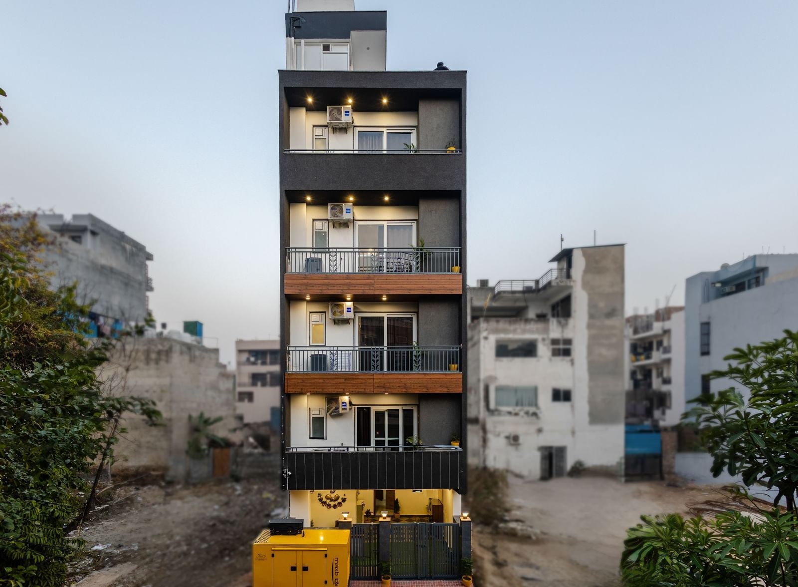 Exterior of Lime Tree Luxury 2BHK Serviced Apartment, Gurgaon featuring multiple storeys and each foor has a balcony attached.