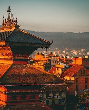An aerial shot of a Buddhist temple and the city around it