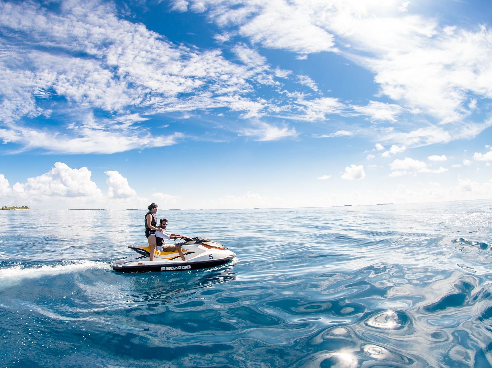 Speed boat with people on an ocean 