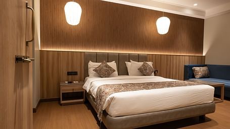 front view of the double bed inside super deluxe room - The Cindrella Hotel, Siliguri