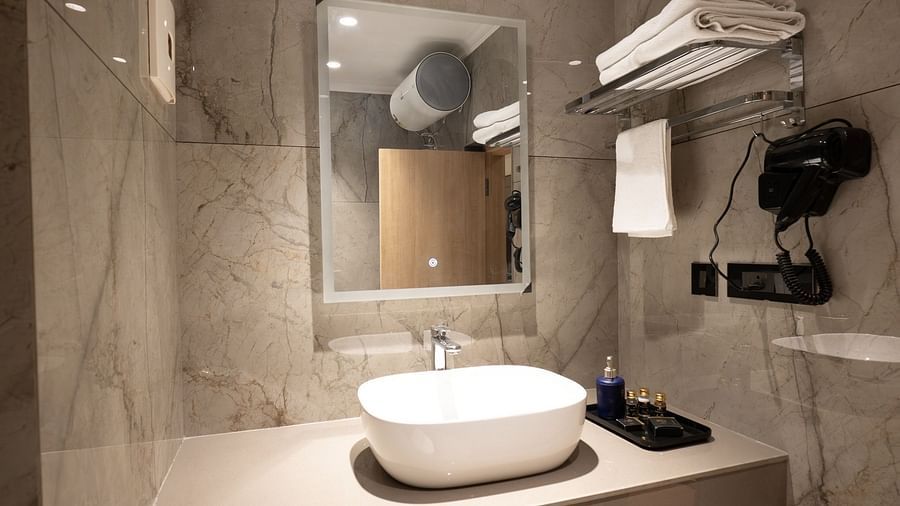 Overview of the bathroom inside executive room - The Cindrella Hotel, Siliguri