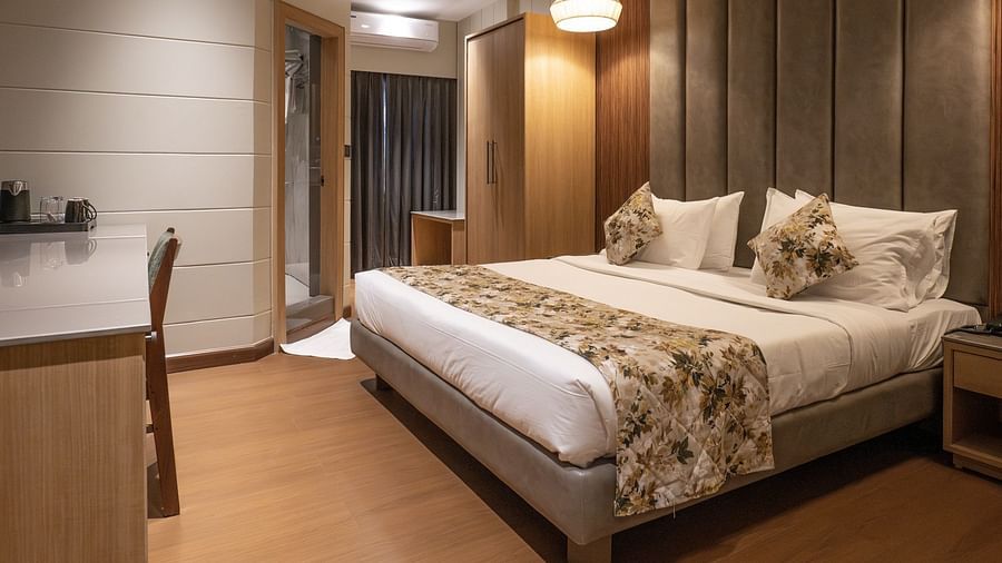 Side view of the double bed inside executive room - The Cindrella Hotel, Siliguri