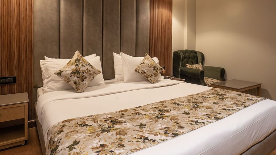 a close up shot of the double bed inside executive room - The Cindrella Hotel, Siliguri