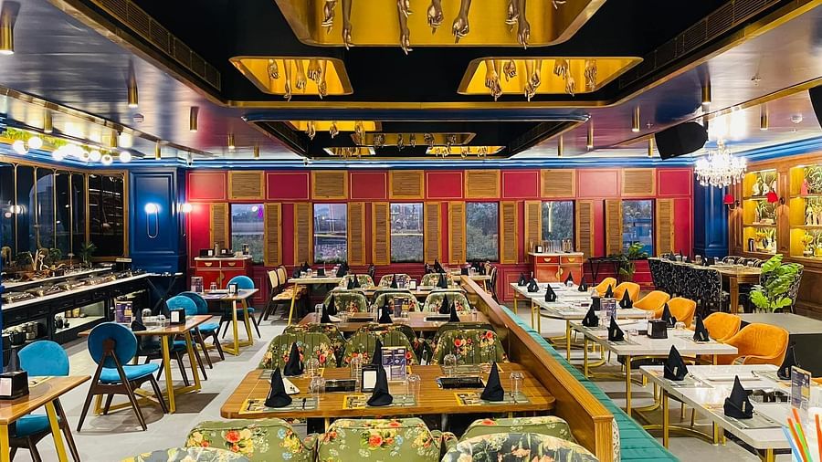An image of a Restaurant Themis Barbecue House NSP Pitampura with various kinds of seating arrangements 