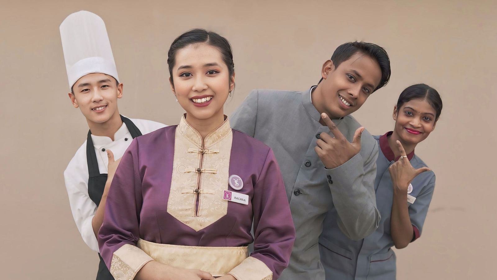 An image of four with different attires dressed according to their job roles - Sumi Yashshree Hotels & Resorts