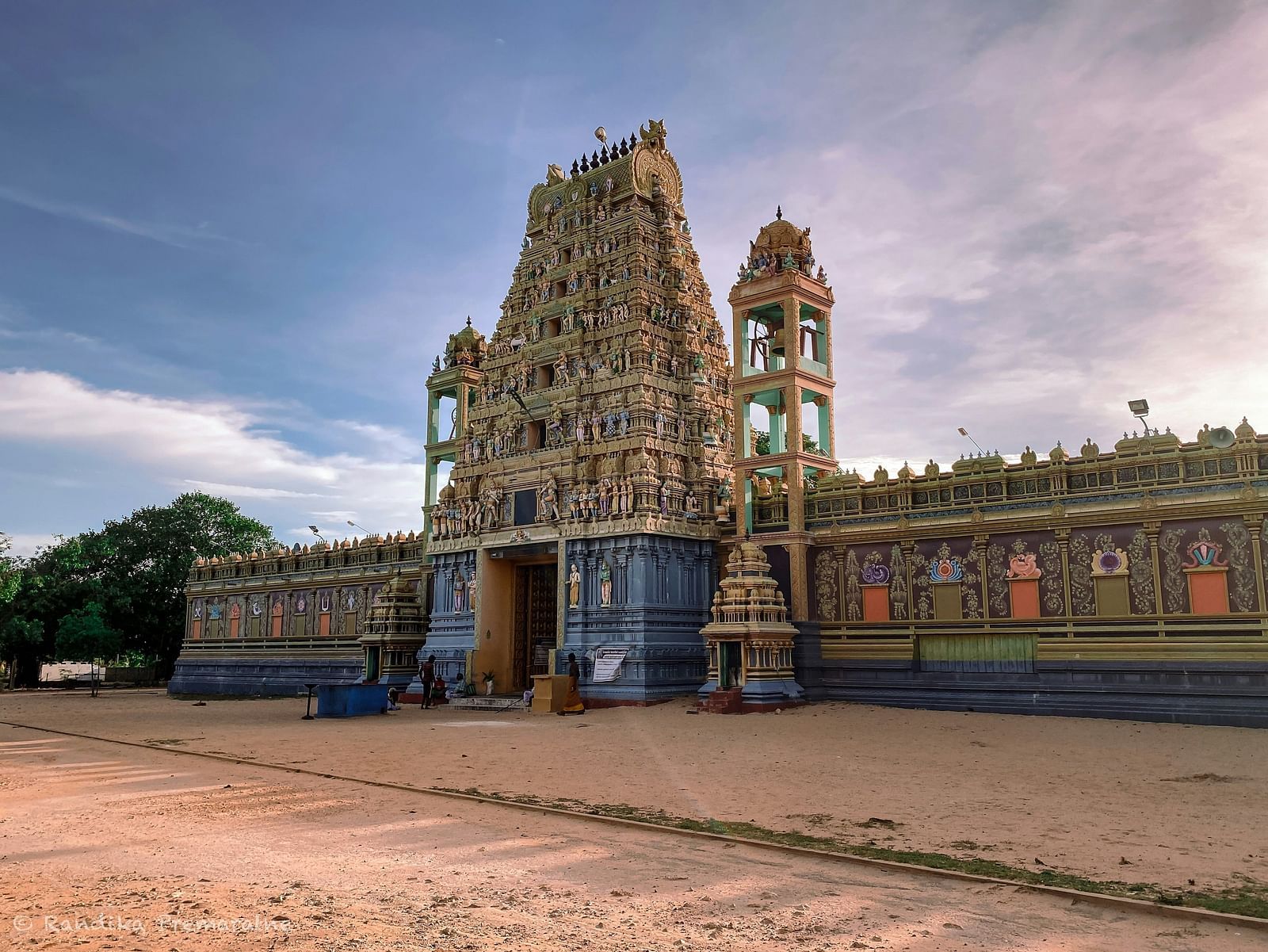 Image of the entrance of a temple that has intricate carvings on it.
