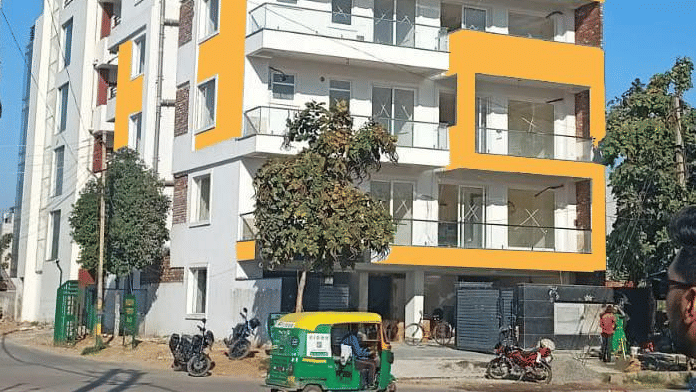 Multiple storey building exterior of Lime Tree Luxury Studio featuring a vehicle parked along the street.