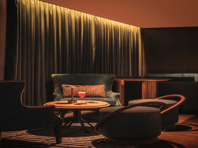 Cosy lounge seating with ambient lighting at The Residency Towers Chennai.