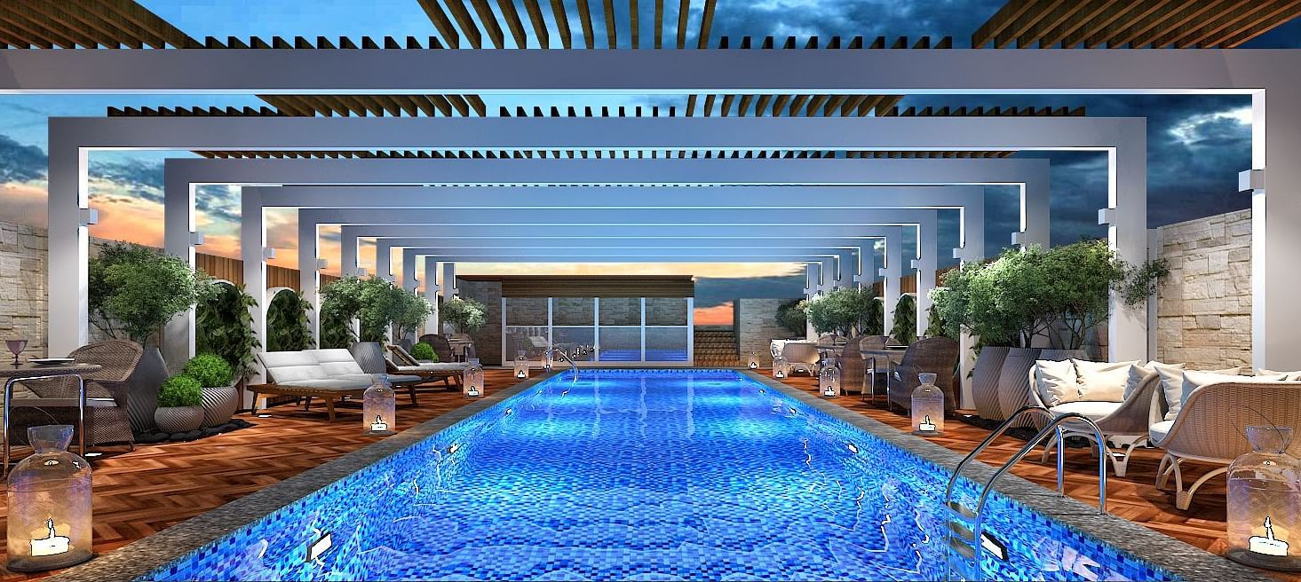 a brightly lit swimming pool at the kertel suite, kishasa with a shed 