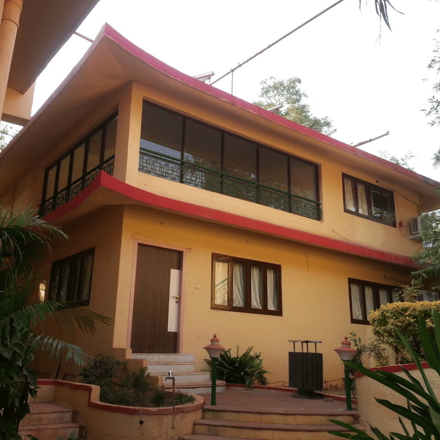 An exterior view of the two floor bungalow of the resort, of of their accommodation options.