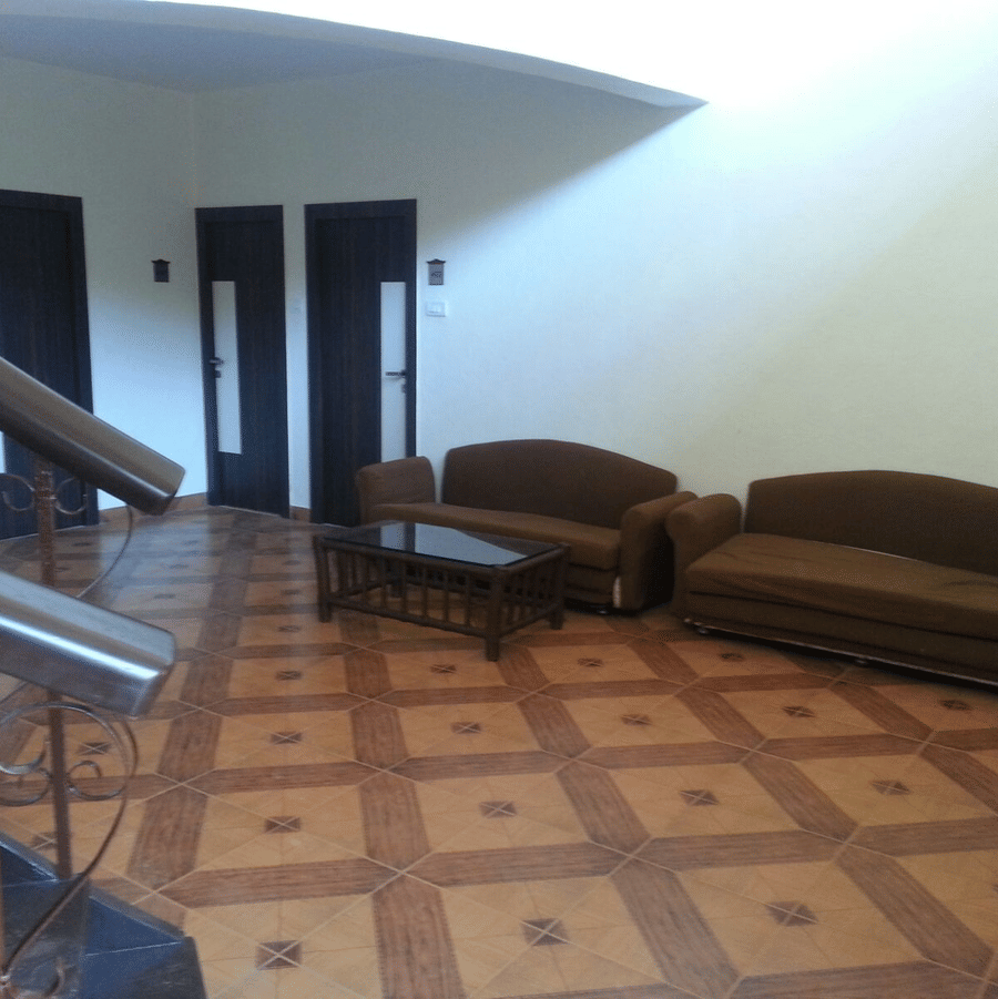 The lobby of the bungalow at the resort furnished with twin sofas and a centre table.