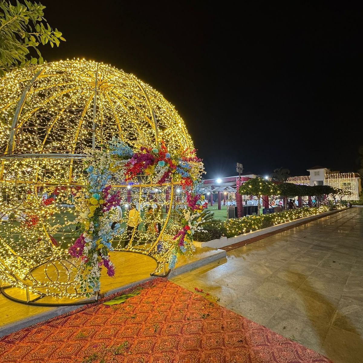 a dome shaped lighting arrangement in a pathway with a car parked nearby at Lords Hrim Akashara Resort Basar