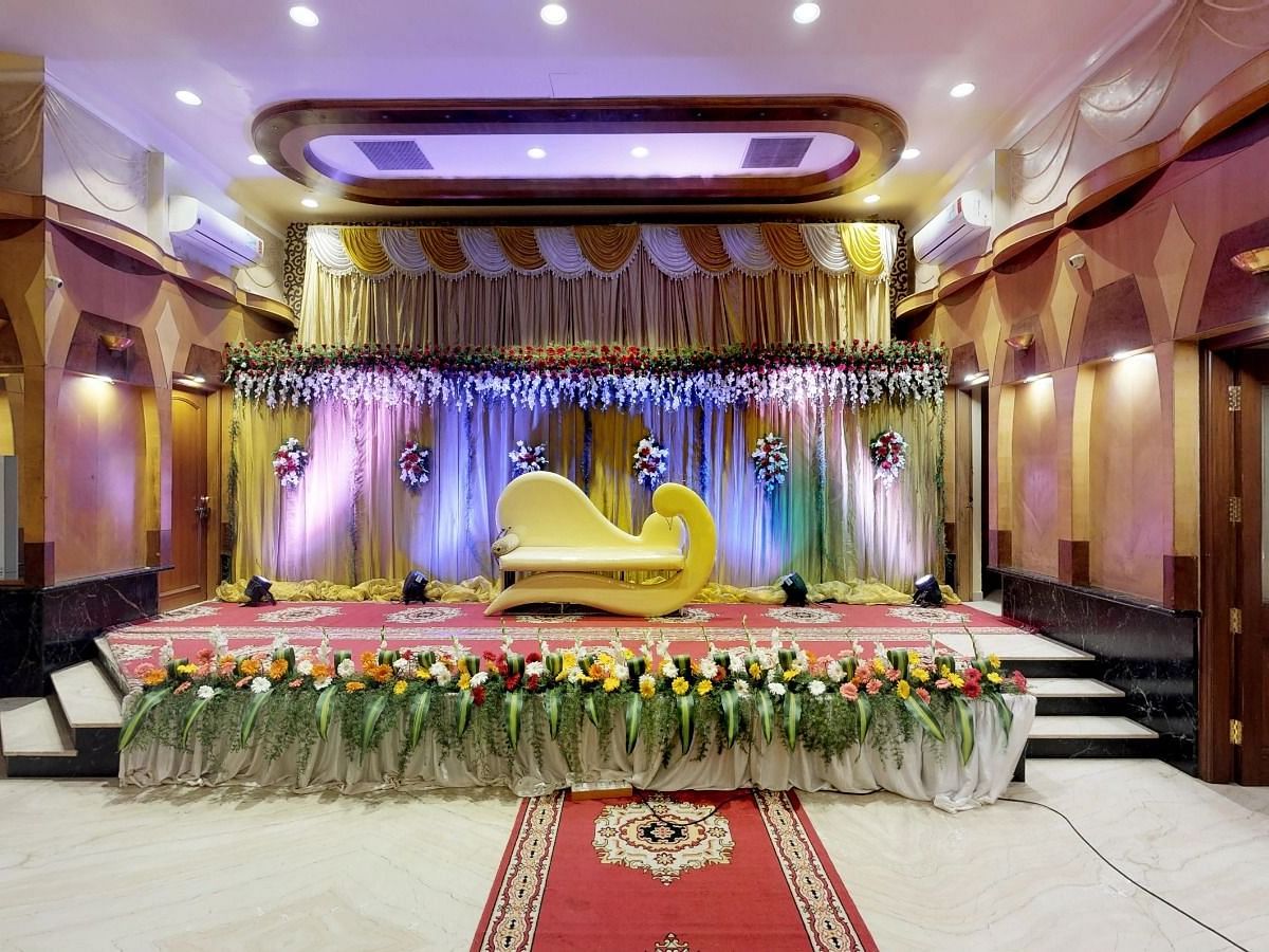 View of a brightly lit stage for a wedding occasion in Sammilan Hall