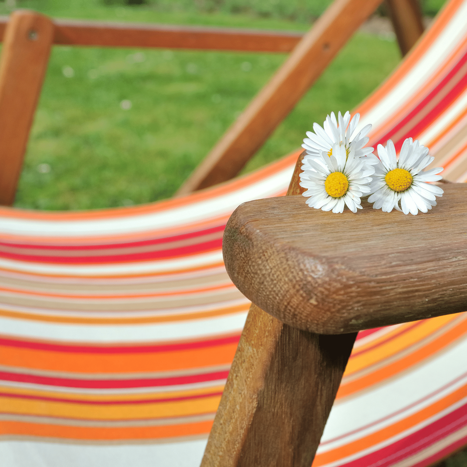 an image of flowers on the handle of a chair