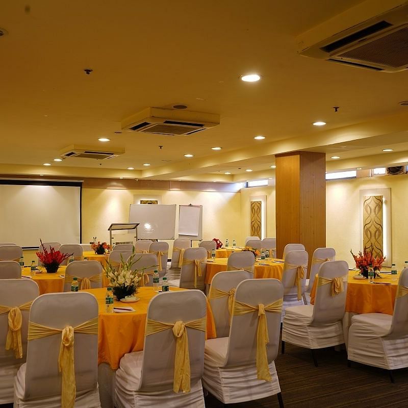 yellow and white chairs at our banquet hall at Shervani Nehru Place, New Delhi