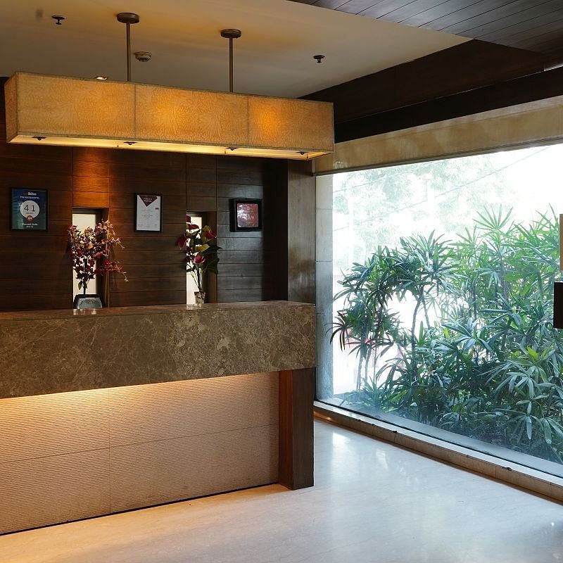 Reception area at Shervani Nehru Place, New Delhi overlooking trees